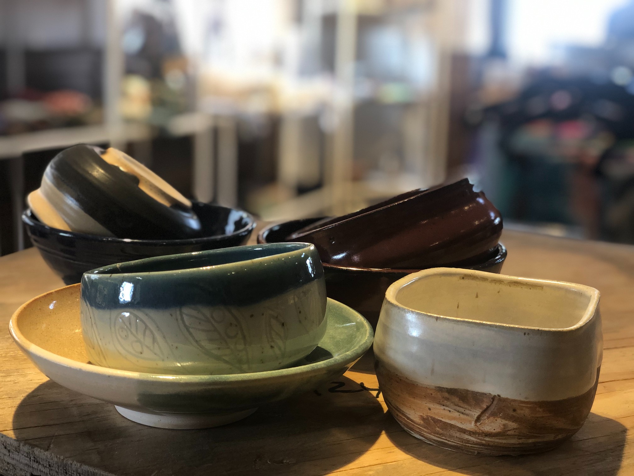 Empty bowls sit on a wooden table