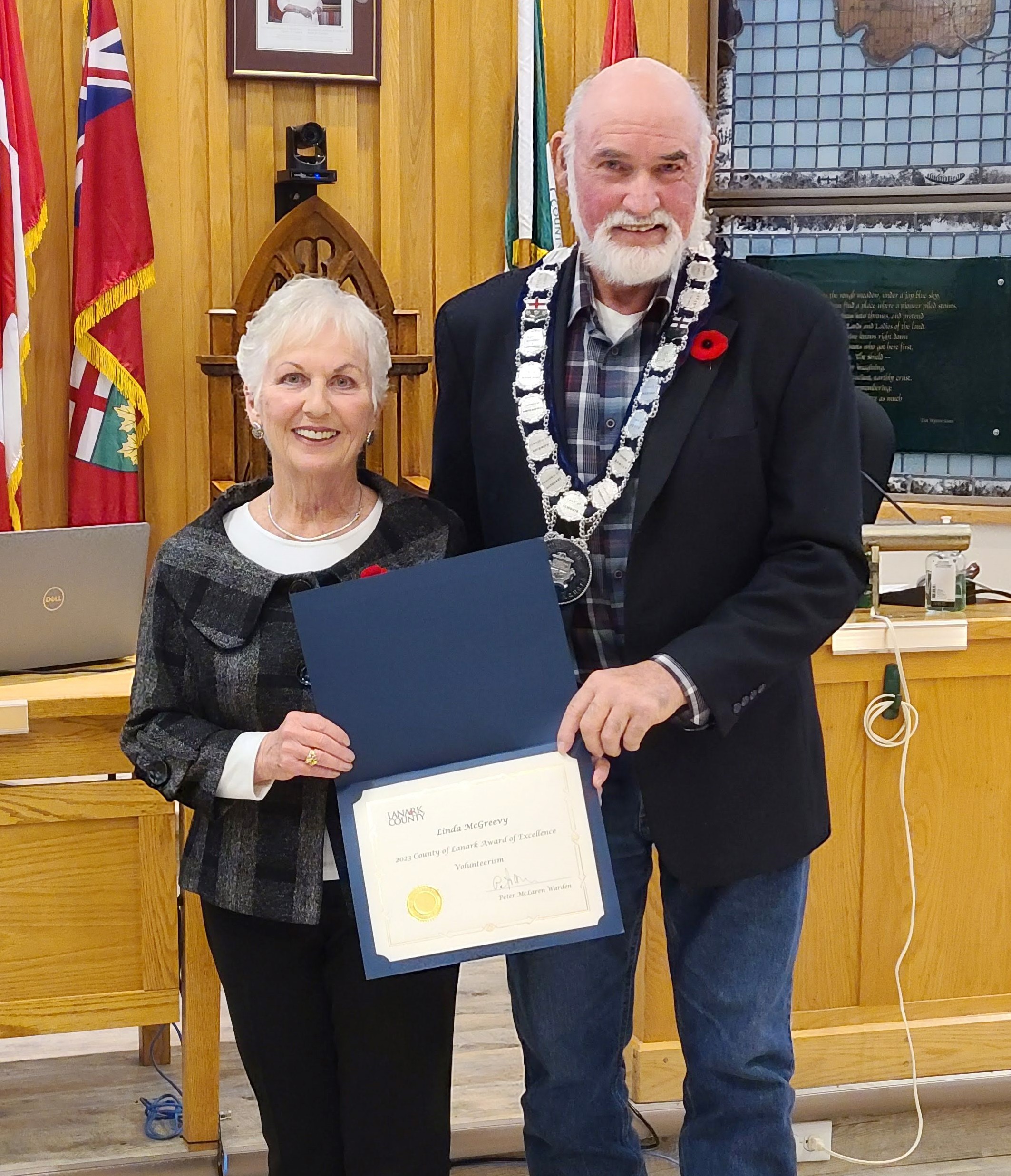 Lanark County Warden Peter McLaren, right, presents an Award of Excellence to Linda McGreevy, left, with the Carleton Place & District Memorial Hospital Foundation Board.