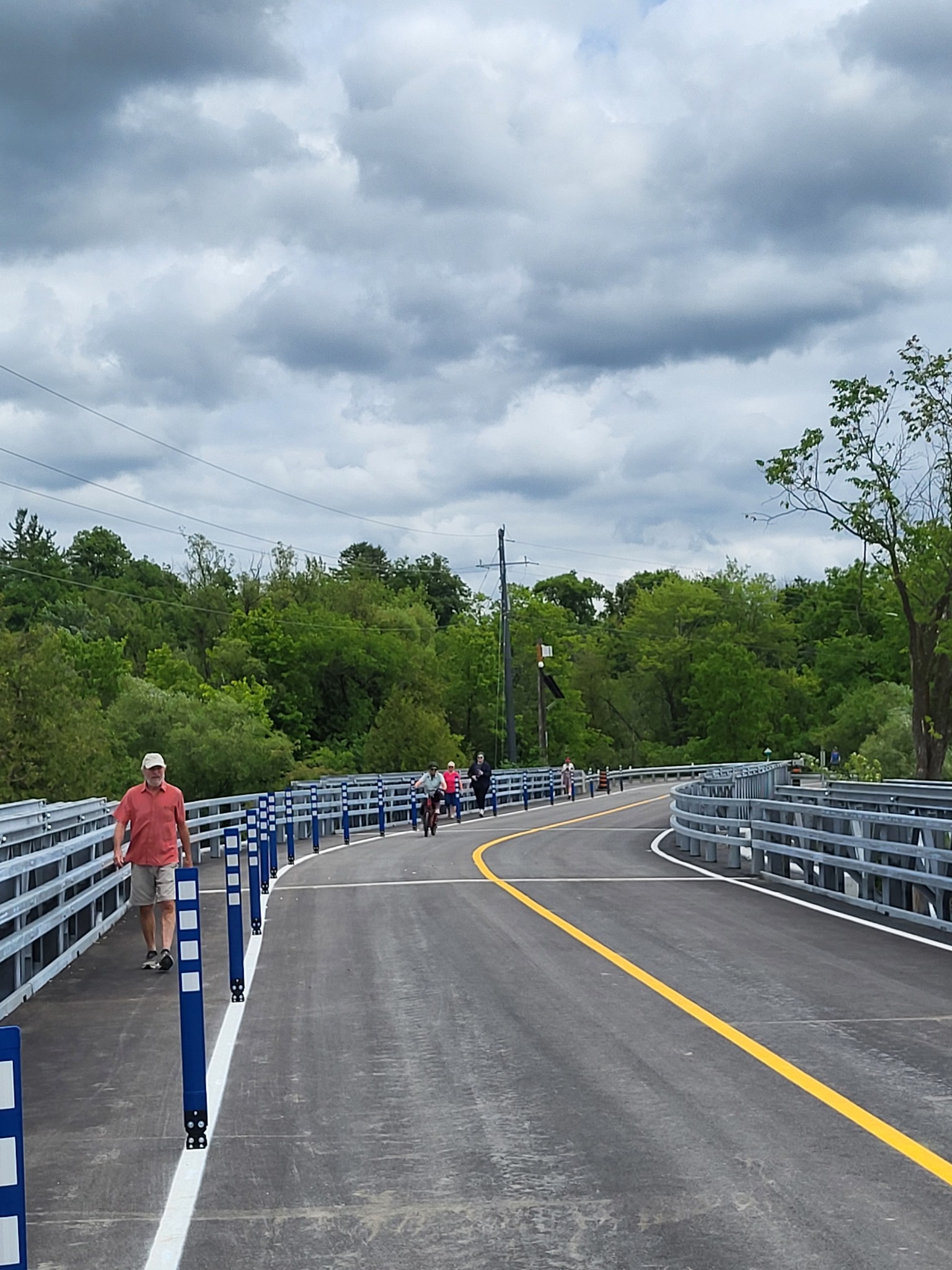 People on a pedestrian walkway of a new modular bridge
