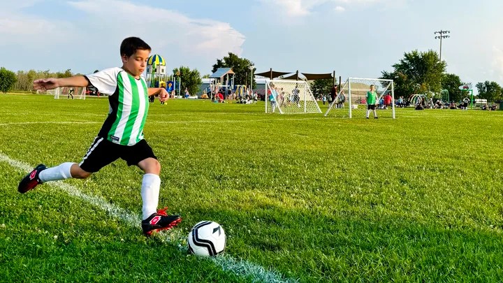 Kid playing soccer