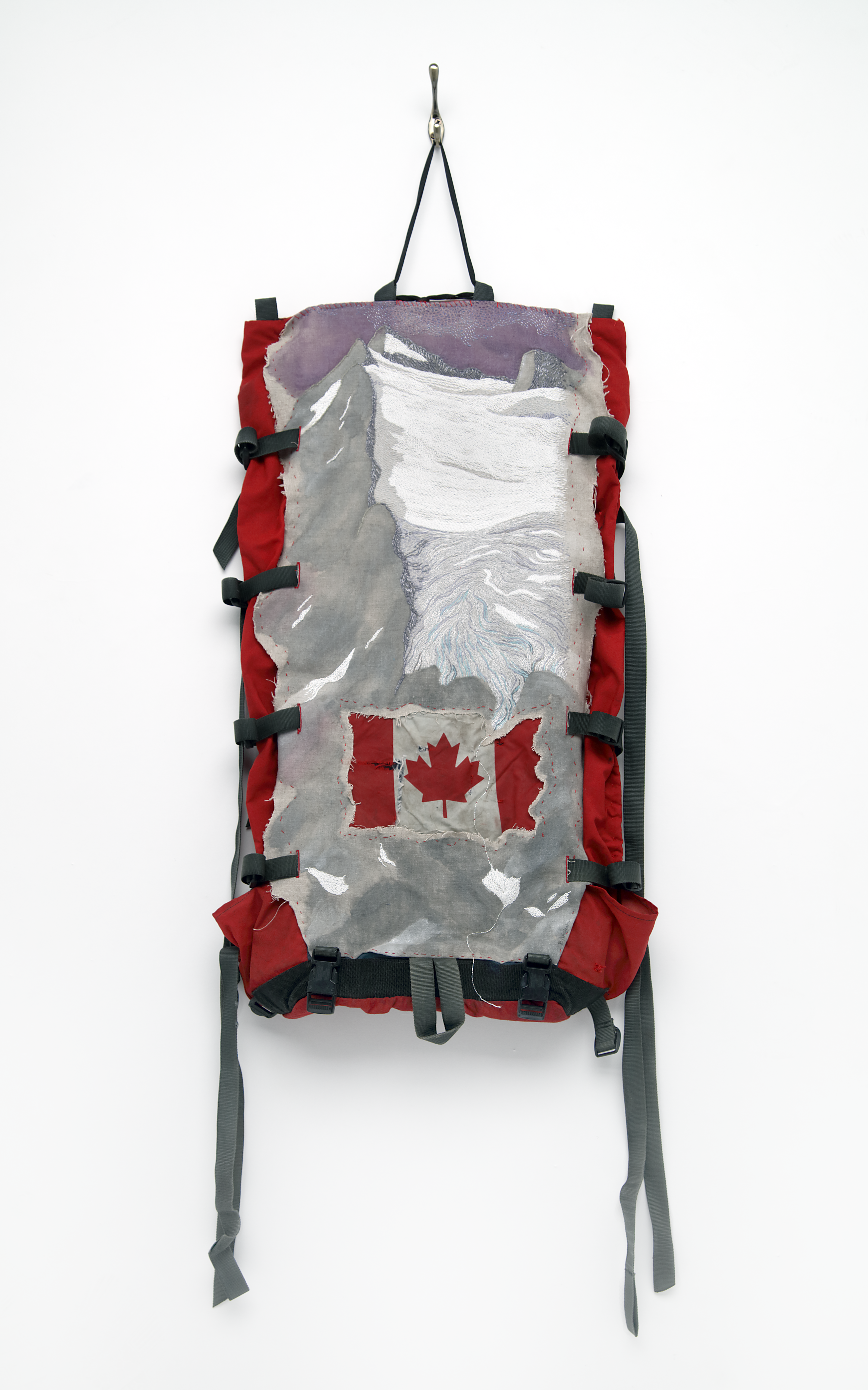 Photo of backpack with Canadian flag from 'Gear' exhibit at Mississippi Valley Textile Museum
