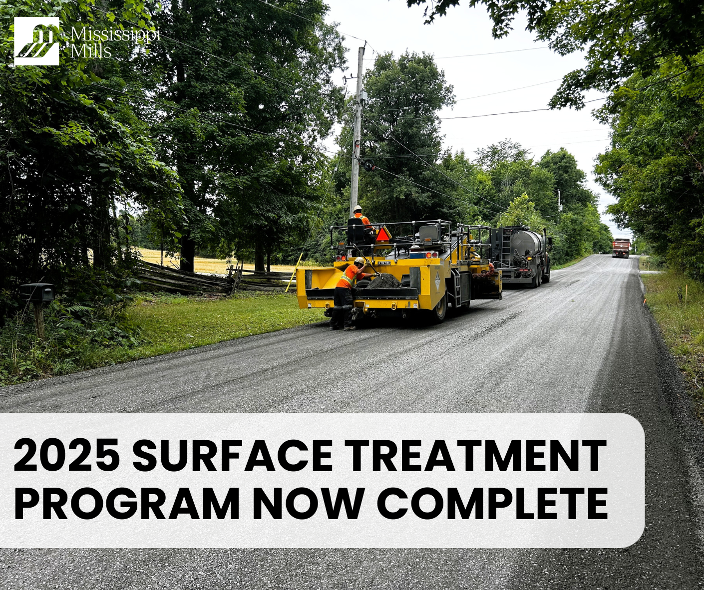 Photo of construction crews applying surface treatment to rural road with the text '2025 Surface Treatment Program Now Complete'