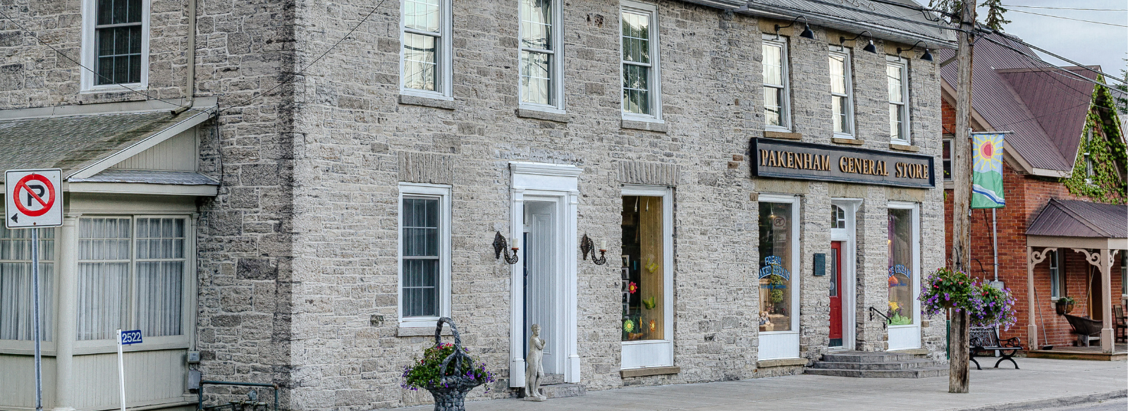 A stone general store building on a small-town street