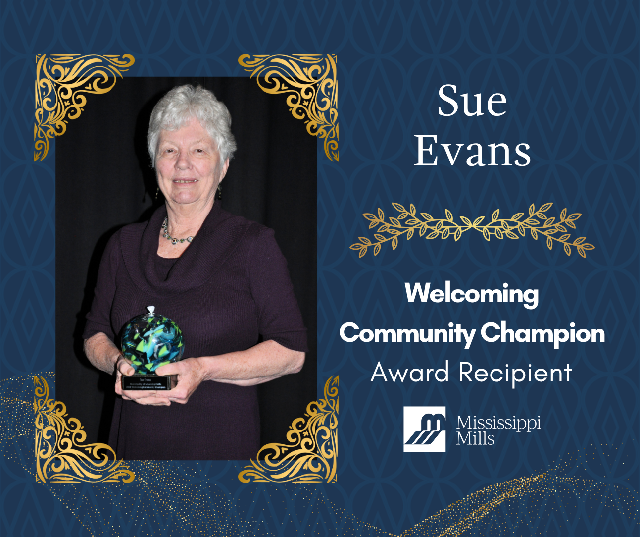 Navy and gold graphic with photo of a woman with short white hair holding an award. Text reads 'Sue Evans - Welcoming Community Champion Award Recipient'